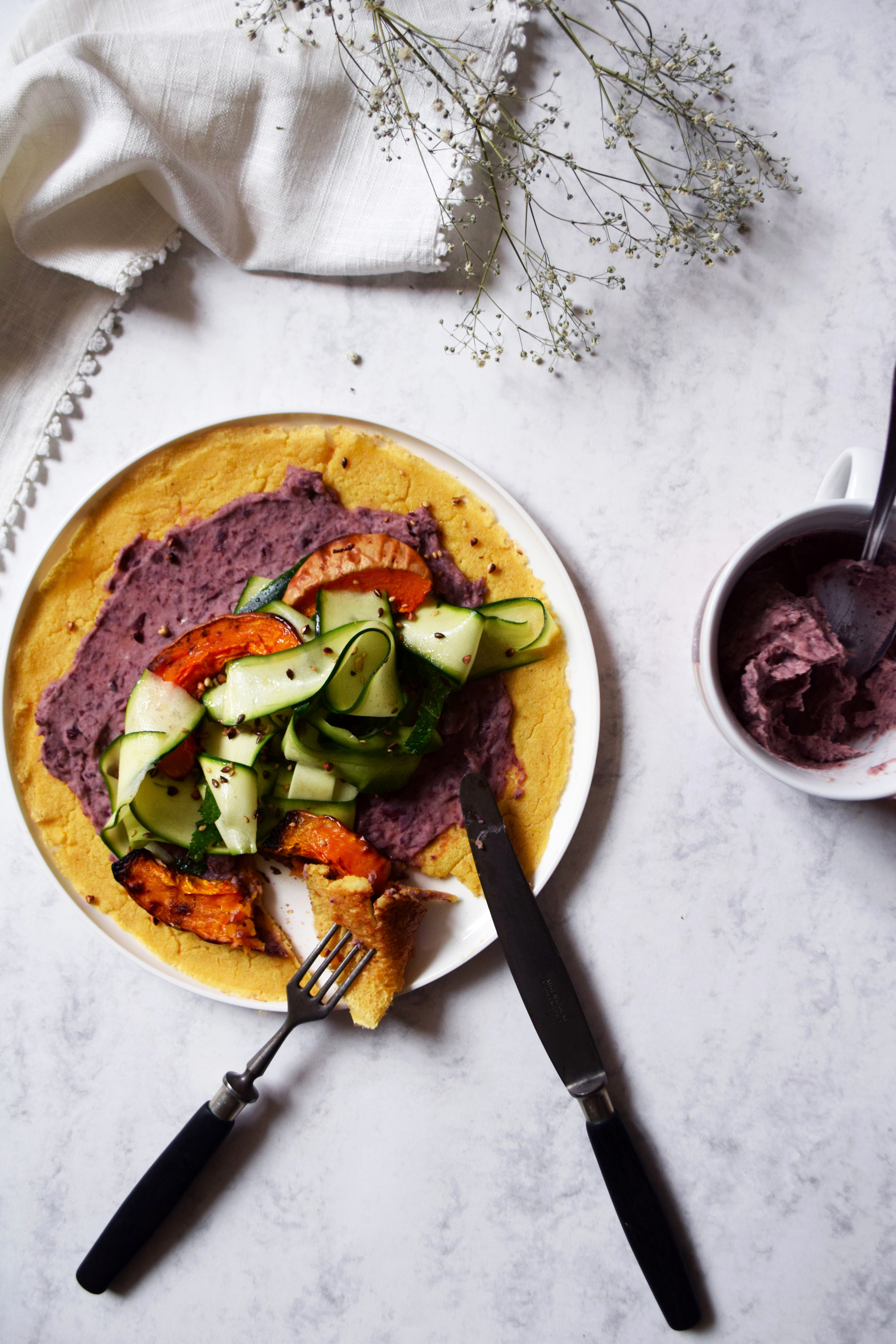 Soccas with red bean cream, marinated zucchinis & roasted butternut squash